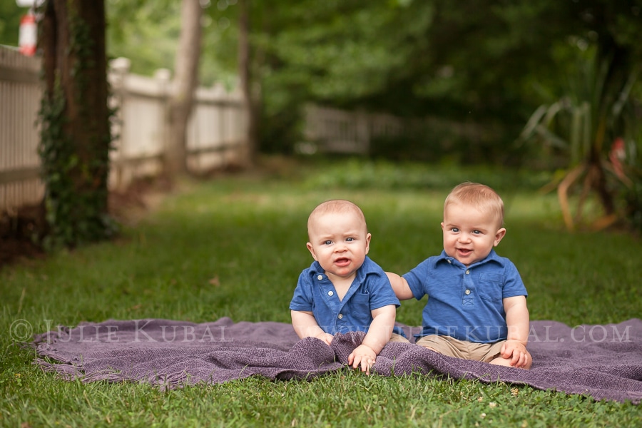 Twin baby boys sitting together on a blanket in a grass lawn Kube-Dent Family - Washington DC family photography