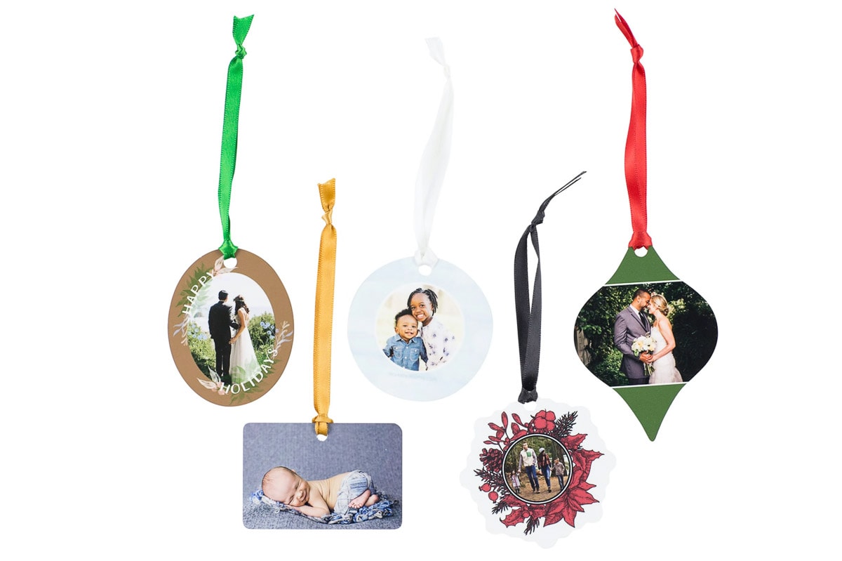 Another way to use your family photos besides for Christmas cards is to create ornaments. The ones shown here are come in a variety of shapes with ready-made designs into which you can insert the photograph.